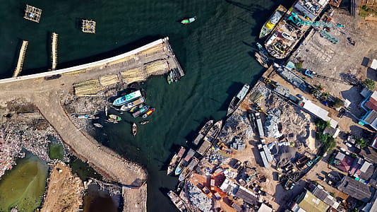 Aerial Photography of Town Near Body of Water thumbnail