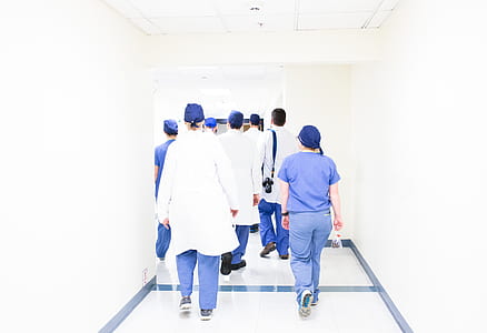 group of person walking on white floor thumbnail
