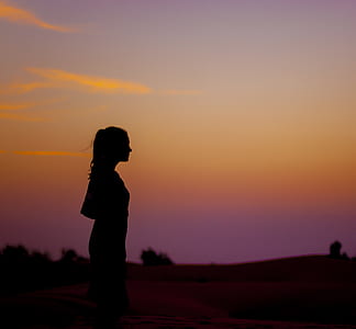 silhouette photo of woman looking towards right thumbnail