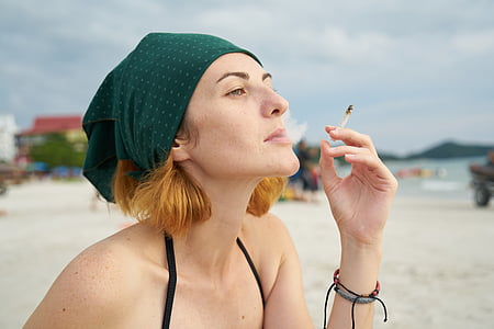 woman holding cigarette stick thumbnail