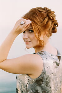 Woman in Sequined Gray Sleeveless Top thumbnail