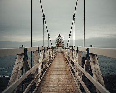 gray steel bridge during cloudy day thumbnail