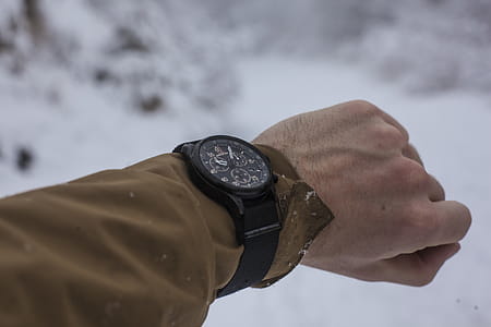 Person in Brown Long-sleeved Top Wearing Chronograph Watch thumbnail