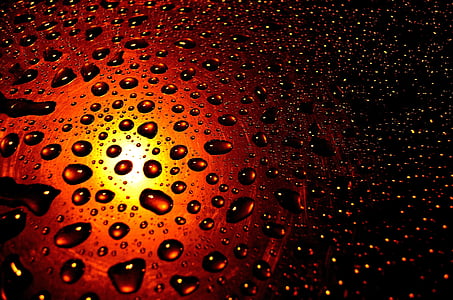 droplets on brown glass surface thumbnail
