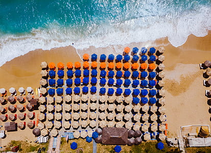 birds eye view of umbrellas on shore thumbnail