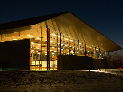 building with turned on light fixtures at night time thumbnail