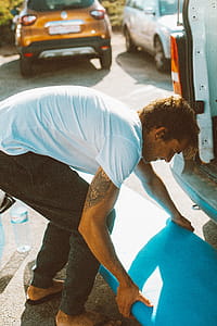 Man Carrying Blue Board thumbnail