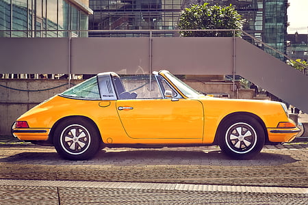yellow convertible near concrete stairs thumbnail