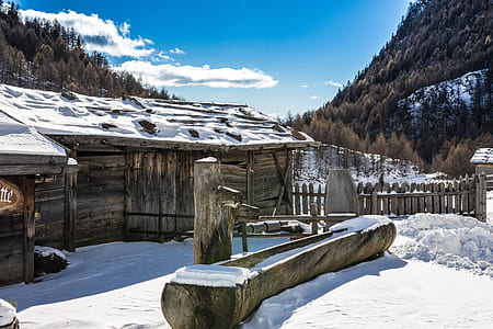gray house near mountain during winter thumbnail