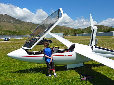 Man Standing in Front of the White Plane thumbnail