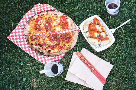 Pizza Salami and Korean dumplings Mandu on a grass thumbnail