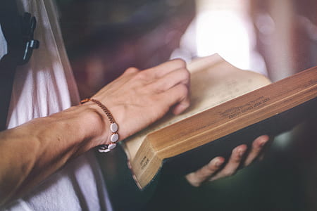 Person Holding Hardbound Book thumbnail