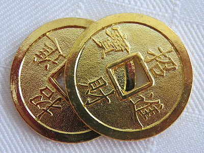 two round gold-colored coins thumbnail