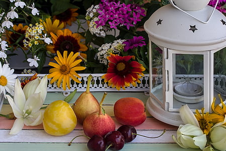 assorted fruits near candle lantern thumbnail