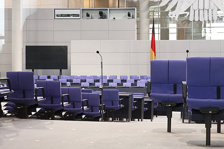 purple chairs beside white wall thumbnail