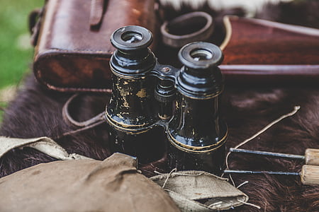 black binoculars on brown fur surface thumbnail
