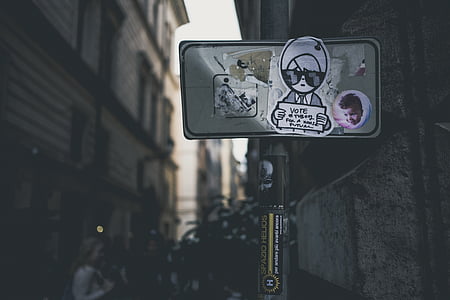 selective focus photography of gray board with sticker signjage thumbnail