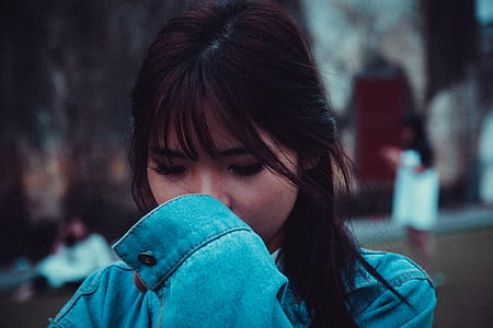 Close-up Photo Woman Wearing Blue Long-sleeved Top thumbnail