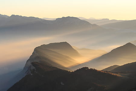 silhouette of mountain with foggy area during daytime thumbnail
