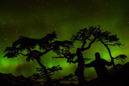 silhouette artwork of man and Aurora Borealis thumbnail