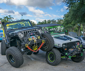two grey and black Jeep Wrangler SUV's thumbnail