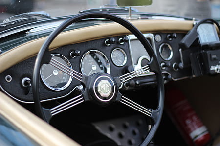 selective focus photography of vehicle steering wheel thumbnail