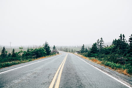 black asphalt road during cloudy day thumbnail