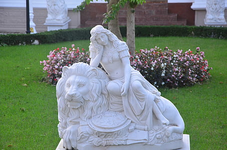 statue of woman lying on lion thumbnail