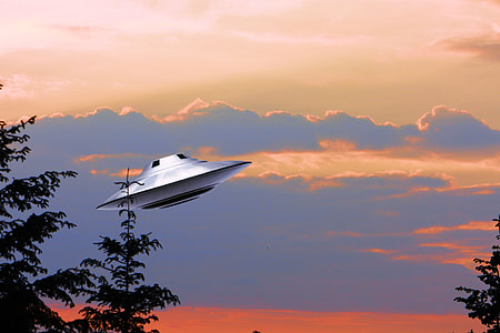 gray spaceship under blue sky thumbnail