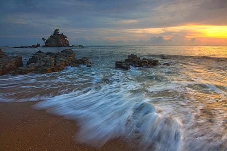 time-lapse photography of brown sand beach thumbnail