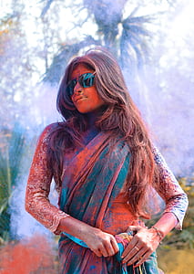 woman holding blue textile thumbnail