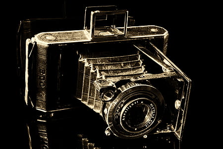 black vintage camera on black surface thumbnail