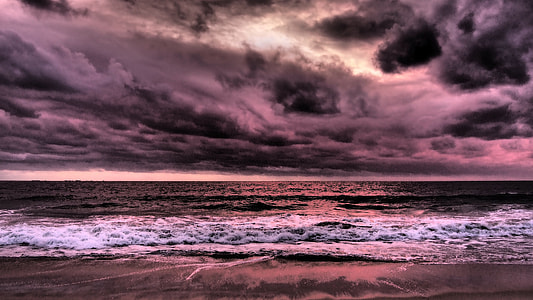 photo of a body of water and dark sky thumbnail