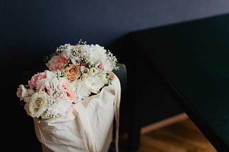 Bouquet of flowers in a bag with some fairy lights thumbnail