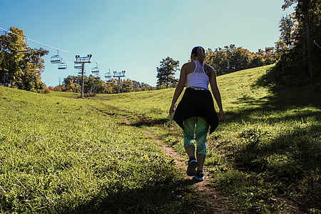 woman walking on pathway thumbnail