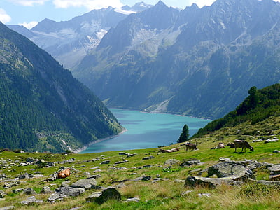 green mountain near body of water thumbnail