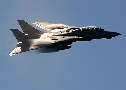 gray jet plane flying mid air under clear blue sky thumbnail