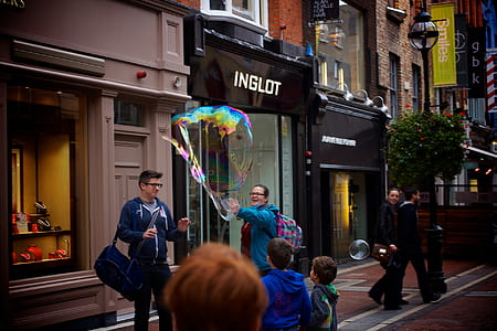 two person playing bubble on street thumbnail