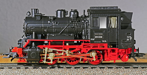 black and red toy train on track thumbnail