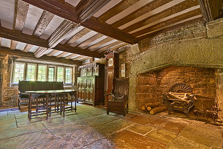 dinning table beside grandfather clock and fireplace thumbnail