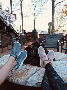 two person wearing gray and pink running shoes thumbnail