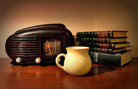 white ceramic coffee cup on brown surface thumbnail