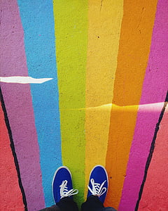 person wearing blue low-top sneakers thumbnail
