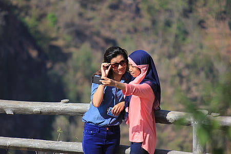 two women taking selfie during daytime thumbnail