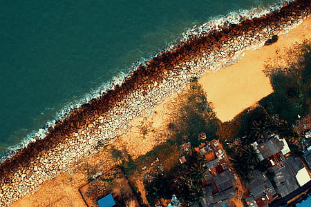 Aerial Photography of Body of Water Near Buildings at Daytime thumbnail