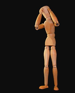 beige manikin on black surface thumbnail