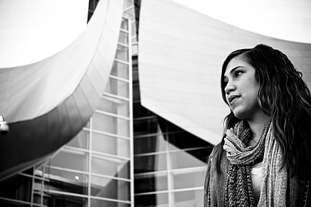 grayscale photography of woman wearing scarf thumbnail