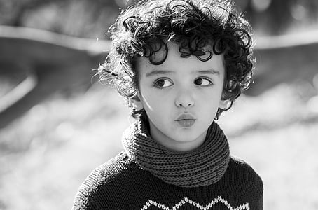 child wearing turtleneck sweater looking right thumbnail