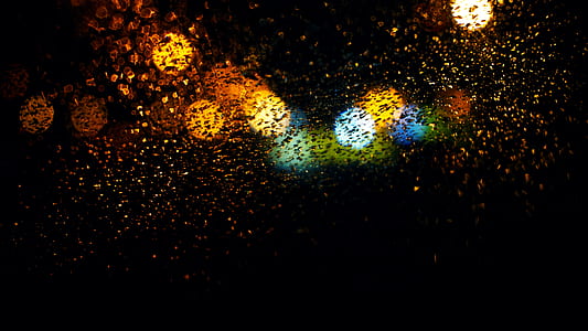 clear glass with water moist and multicolored bokeh effects through glass thumbnail