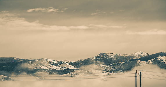 Cable Wires in Front of Snow Covered Mountains thumbnail